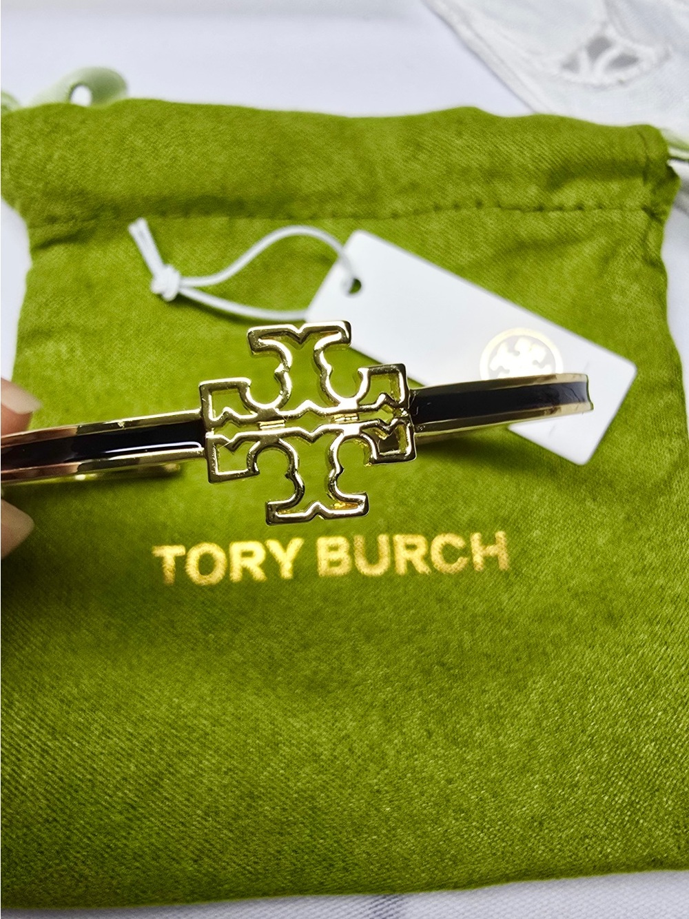 Tory Burch Gold Logo Hinge Bracelet with Black Enamel Detail
